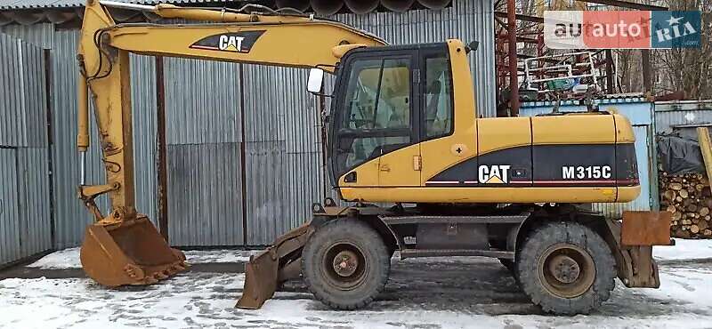 Колесный экскаватор Caterpillar 315 2006 в Киеве