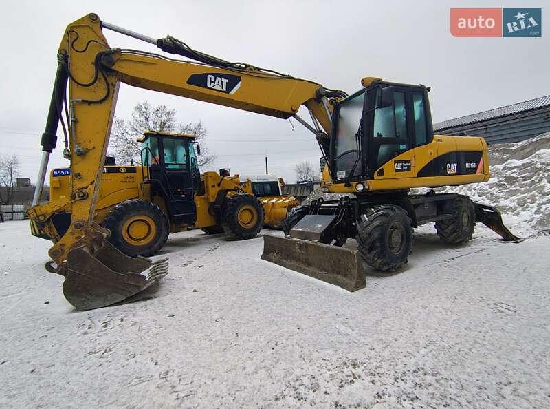Колесный экскаватор Caterpillar 316 2009 в Николаеве