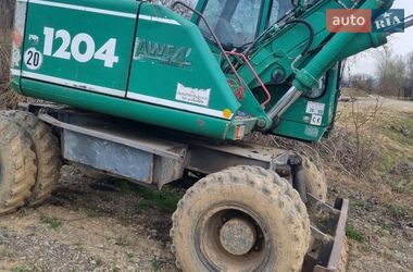 Колісний екскаватор Atlas 1204 1999 в Бедевлі