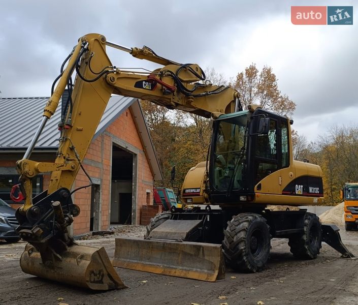 Колесный экскаватор Caterpillar 313 2007 в Львове