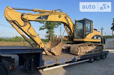 Экскаватор погрузчик Caterpillar 318 2005 в Тячеве