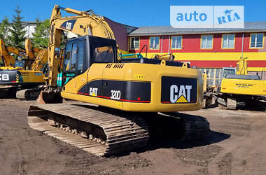 Гусеничный экскаватор Caterpillar 320 2009 в 