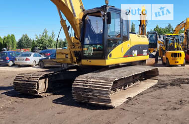 Гусеничный экскаватор Caterpillar 320 2009 в 