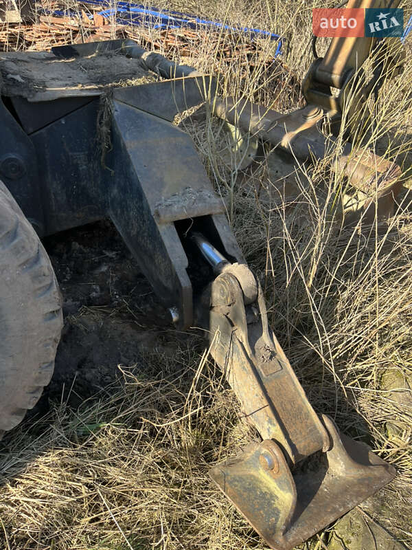 Колесный экскаватор Caterpillar M312 2001 в Косове