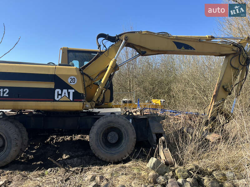 Колесный экскаватор Caterpillar M312 2001 в Косове