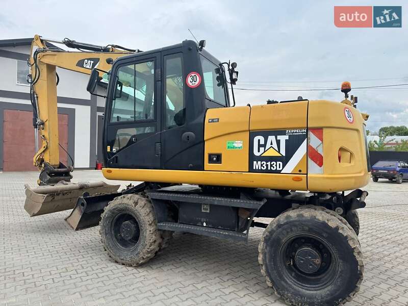 Колесный экскаватор Caterpillar M313 2012 в Долине