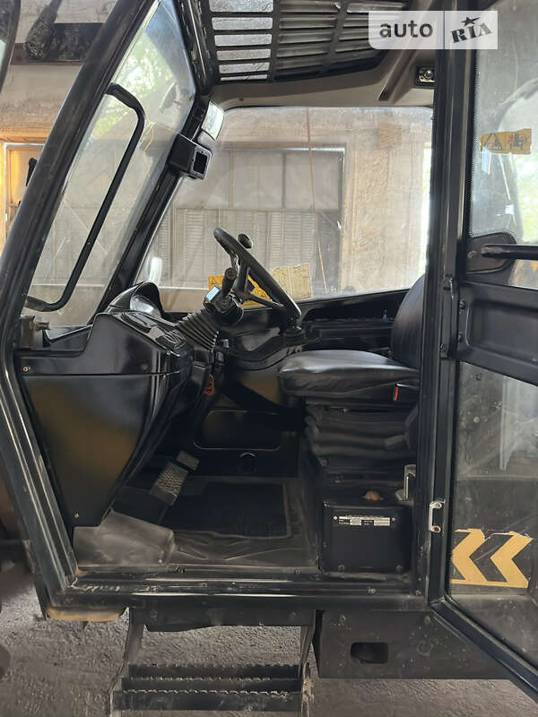 Телескопический погрузчик Caterpillar TH 414 2009 в Одессе
