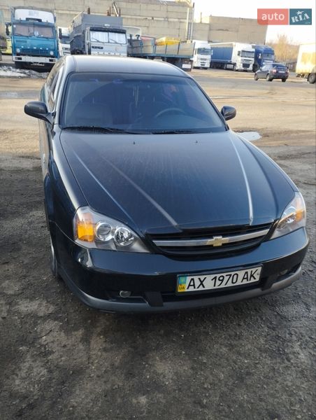 2006 Chevrolet Evanda, VIN KL1LF69ZE6B192640:plate — фото 1 (autoria)