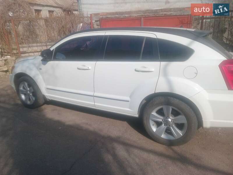 2011 Dodge Caliber, VIN 1B3CB4HA8AD579732:plate — фото 1 (autoria)