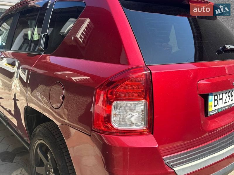 2012 Jeep Compass, VIN 1C4NJDCB7CD608408:plate — photo 1 (autoria)