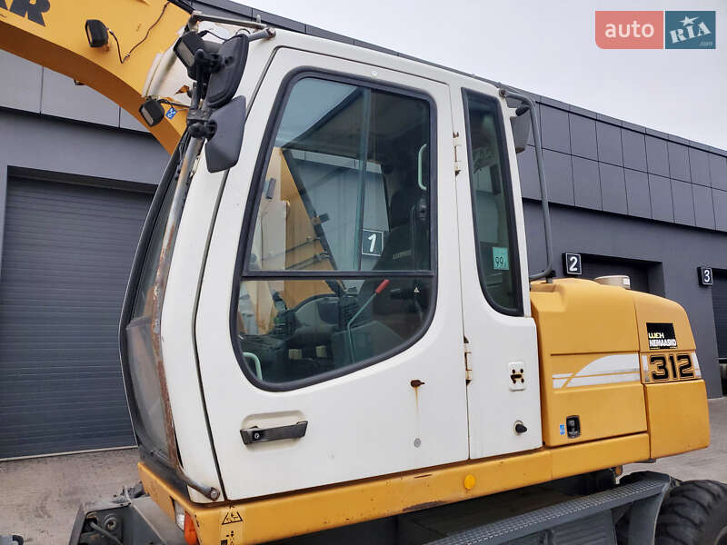 Колесный экскаватор Liebherr 312 2010 в Ровно