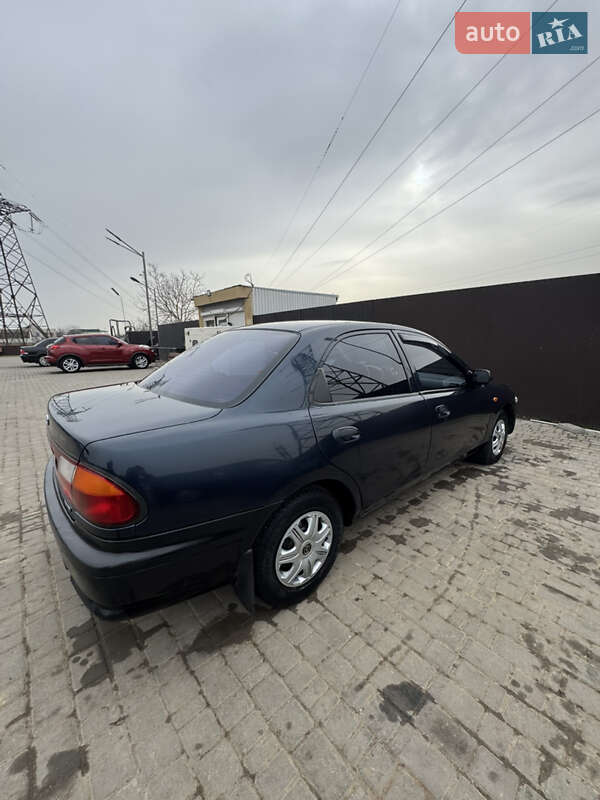 Седан Mazda 323 1997 в Одессе фото 12 Седан Mazda 323 1997 в Одессе