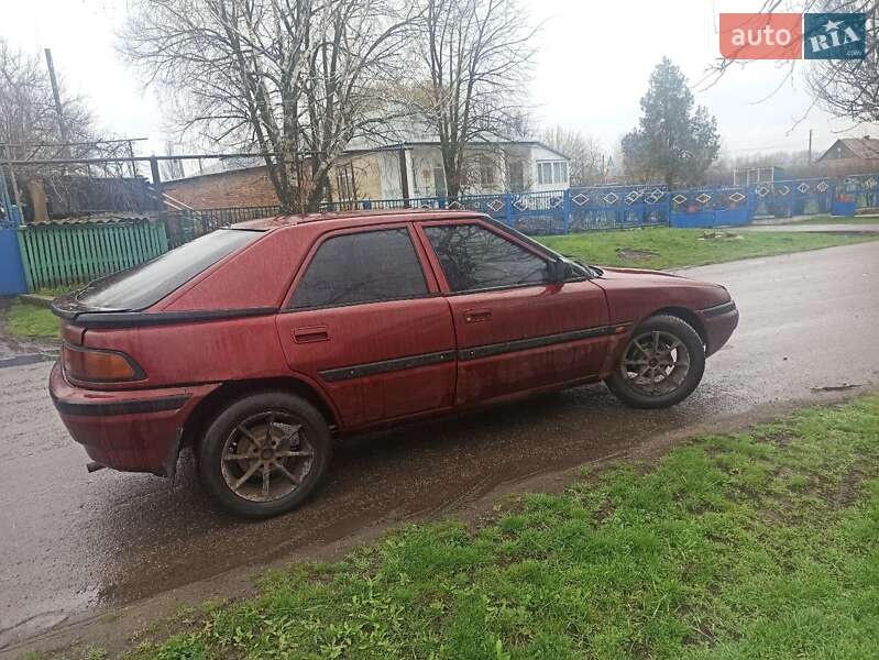 Хетчбек Mazda 323 1993 в Чумаках фото 5 Хетчбек Mazda 323 1993 в Чумаках