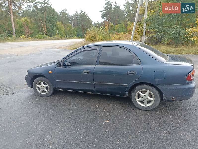 Седан Mazda 323 1995 в Богуславе фото 5 Седан Mazda 323 1995 в Богуславе