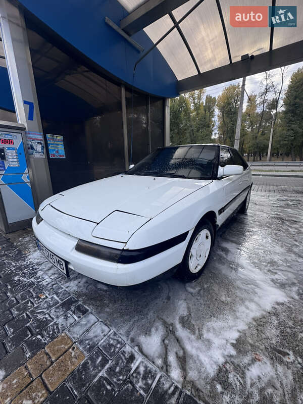 Хэтчбек Mazda 323 1990 в  фото Хэтчбек Mazda 323 1990 в