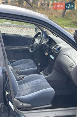 Седан Mazda 323 1999 в  фото 9 Седан Mazda 323 1999 в