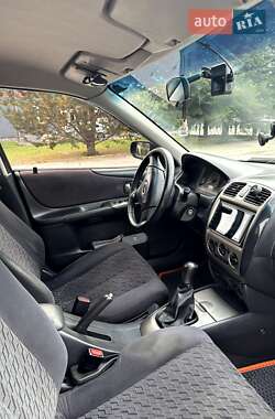 Хэтчбек Mazda 323 2001 в  фото 20 Хэтчбек Mazda 323 2001 в