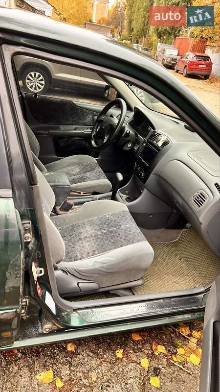 Хетчбек Mazda 323 1999 в Києві фото 7 Хетчбек Mazda 323 1999 в Києві