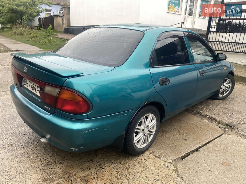 Седан Mazda 323 1998 в Одесі фото 23 Седан Mazda 323 1998 в Одесі