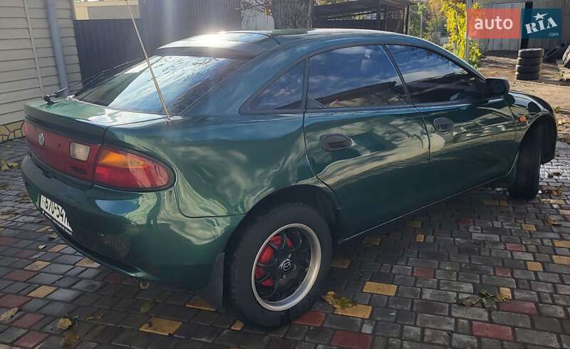 Хетчбек Mazda 323 1998 в Подільську фото 5 Хетчбек Mazda 323 1998 в Подільську