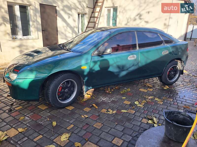 Хетчбек Mazda 323 1998 в Подільську фото 8 Хетчбек Mazda 323 1998 в Подільську