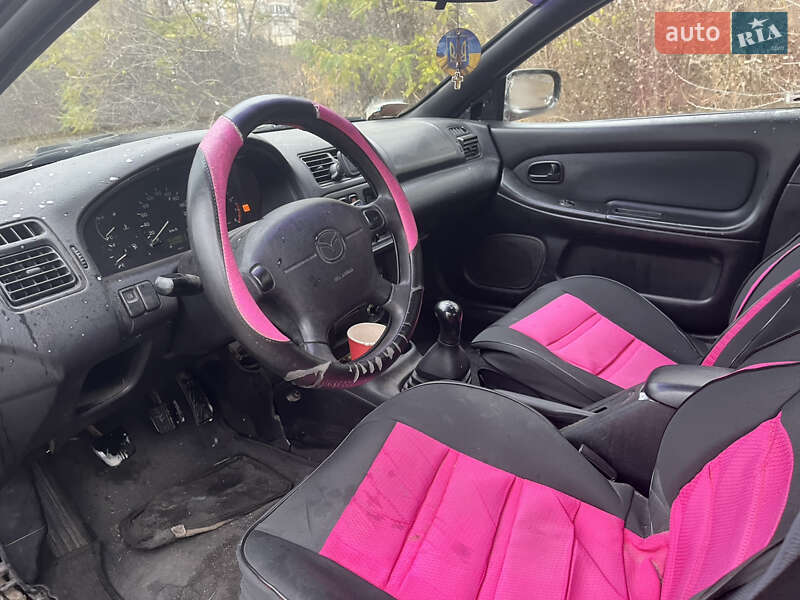 Хэтчбек Mazda 323 1994 в Вышгороде фото 19 Хэтчбек Mazda 323 1994 в Вышгороде