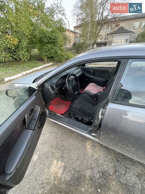 Хетчбек Mazda 323 1994 в Роздільній фото 2 Хетчбек Mazda 323 1994 в Роздільній
