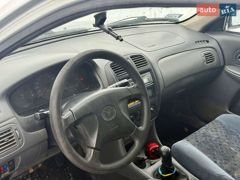 Хэтчбек Mazda 323 1999 в Калиновке фото 15 Хэтчбек Mazda 323 1999 в Калиновке