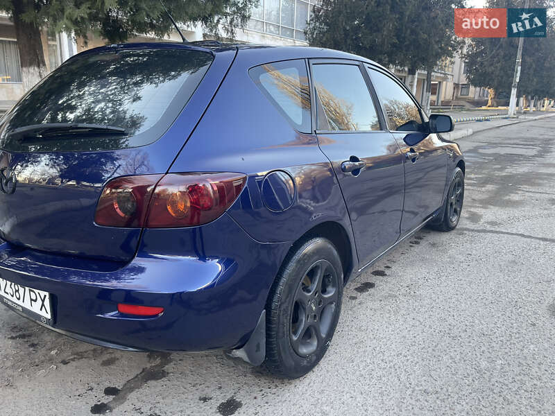Хетчбек Mazda 3 2004 в Рені фото 9 Хетчбек Mazda 3 2004 в Рені