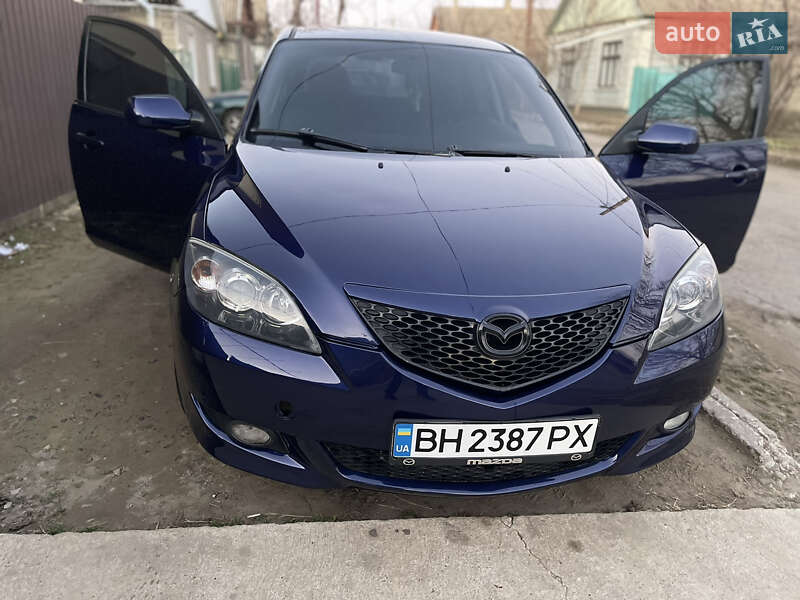 Хетчбек Mazda 3 2004 в Рені фото 13 Хетчбек Mazda 3 2004 в Рені