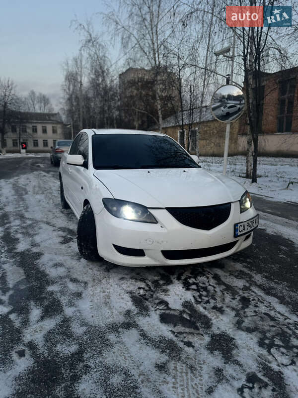 2006 Mazda 3, VIN JM1BK12F261499302:plate — фото 1 (autoria)