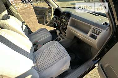 Хэтчбек Mazda Demio 2002 в 