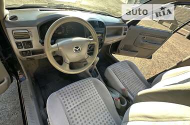 Хэтчбек Mazda Demio 2002 в 