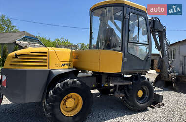 Колесный экскаватор Mecalac 12MXT 2010 в 