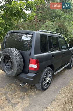 Внедорожник / Кроссовер Mitsubishi Pajero Pinin 2002 в 